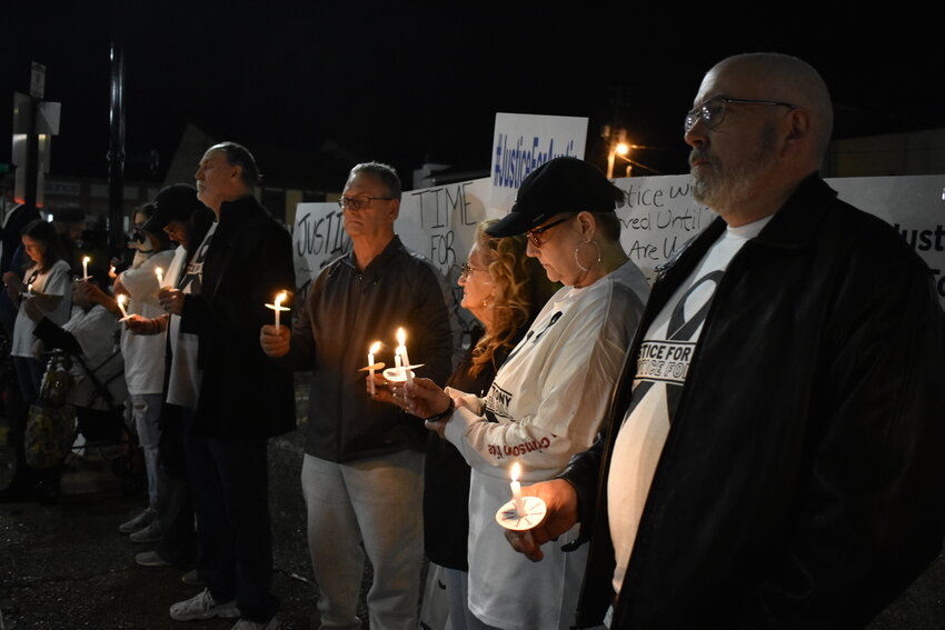 About 30 protesters hold lit candles in protest to alleged mistreatment they said resulted in the death of Anthony Mitchell and others at the Walker County Jail during a March 11 vigil across the street from the jail. They also objected to remarks posted on the Walker County Sheriff's Office Facebook page that seemed to criticize Mitchell's family.