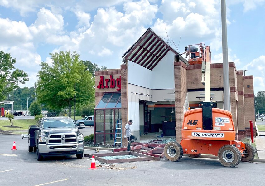 Construction crews are pictured removing the skylight at the Jasper Arby's on Tuesday. The restaurant's dining room is being renovated and will reopen in late May.