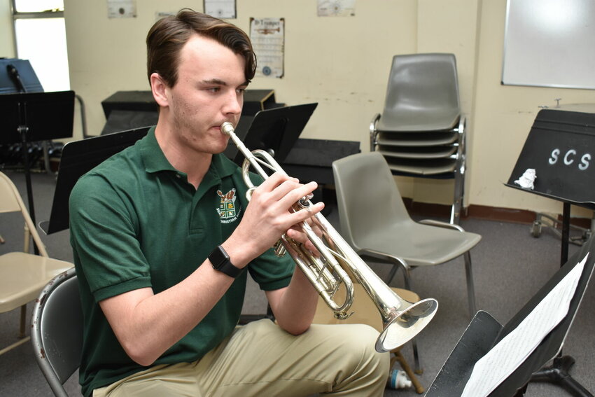 Sumiton Christian School senior Nicholas DeFore plays the trumpet in the Sumiton Christian School band hall. He has been a student leader in the band program.
