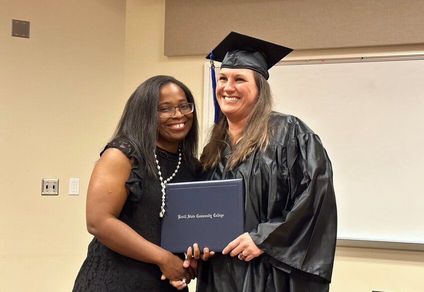 Director of Adult Education Dr. Stephanie Maddox is pictured with a graduate of the Adult Education program last week at Bevill State.
