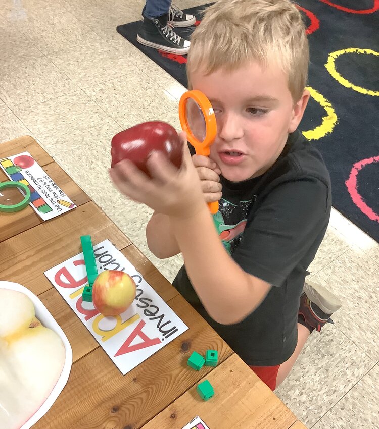 A student in a P-3 designated classroom at Lupton Jr. High School learns during an activity designed to teach math skills and nutrition.