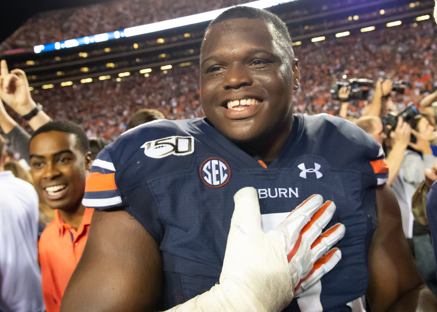 Auburn Tigers defensive end Marlon Davidson (3) is all smiles after the Tiger’s 48-45 win over Alabama, at Jordan-Hare Stadium in Auburn, AL. Daily Mountain Eagle -  Jeff Johnsey