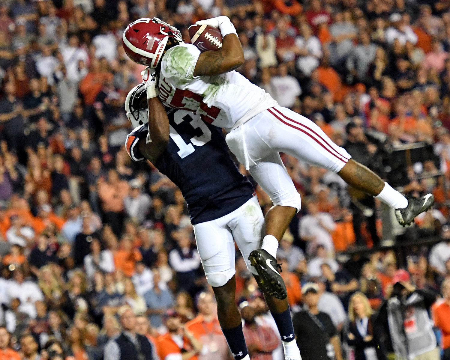 Alabama Crimson Tide wide receiver Jaylen Waddle (17) leaps for the touchdown catch during the second half of an NCAA football game against the Auburn Tigers Saturday, Nov. 30, 2019, at Jordan-Hare Stadium in Auburn, Ala.
