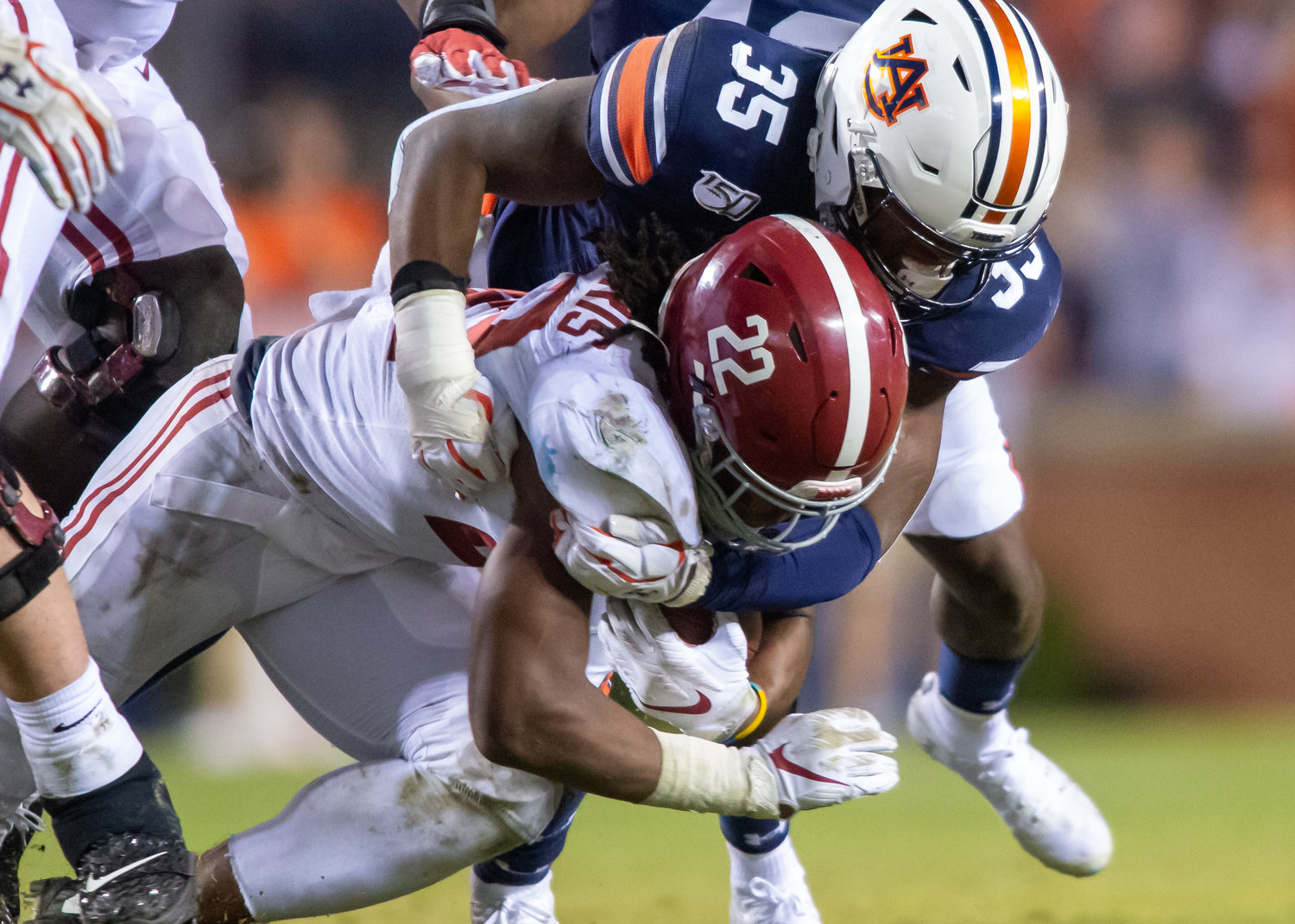 Alabama Crimson Tide running back Najee Harris (22) is brought down by Auburn Tigers linebacker Zakoby McClain (35) during the second half of Saturday's game, at Jordan-Hare Stadium in Auburn, AL. Daily Mountain Eagle -  Jeff Johnsey