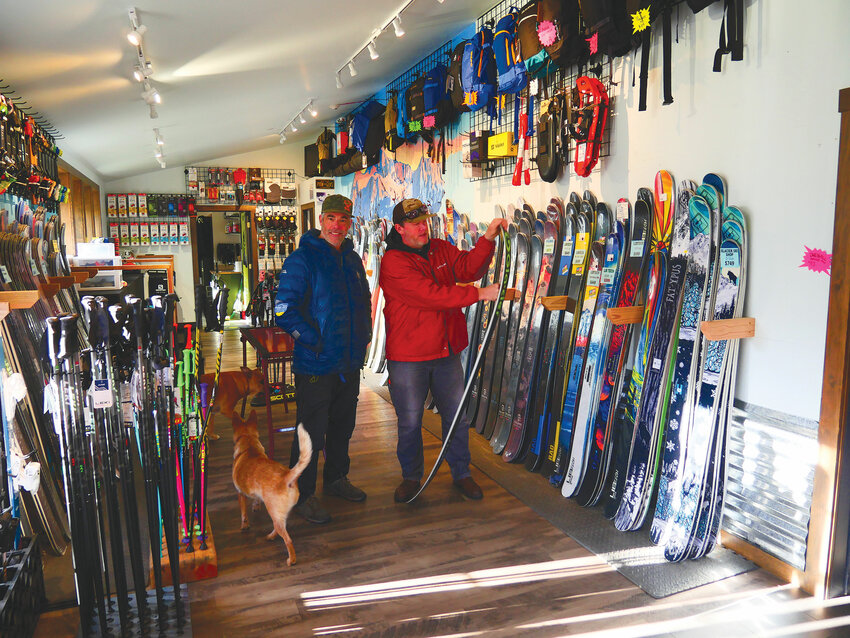 John, L, and Drew and dogs in the ski sales area.
