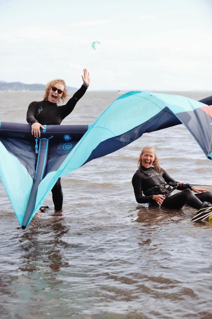 Kiteboarders Darcie Gray and BRittany Grangers enjoying a windy day in Bellingham Bay.