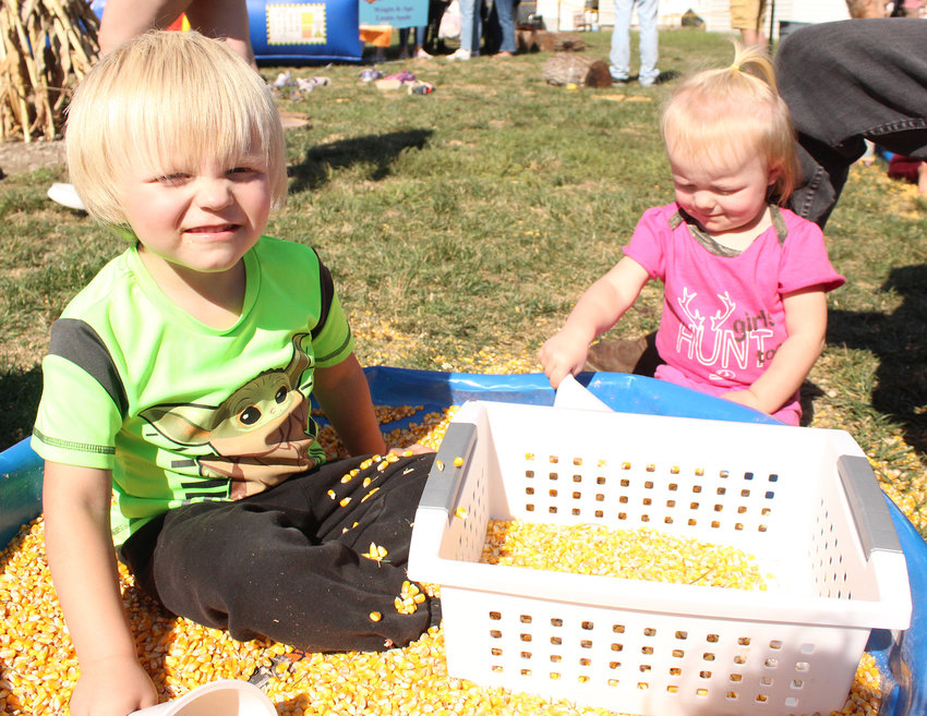 Axel and Nyx Ruffcorn enjoyed the corn pit in the kids’ corner of Applefest.
