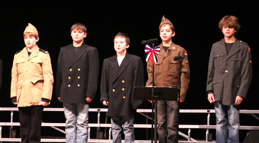 Members of the Schleswig sixth grade class preformed Army Cadences during the Veterans Day program on Nov. 11. Pictured are Noah Westphalen, Ezden Hargens, Matthew Fries, Gavin Lidgett, and Kyson Ransom.