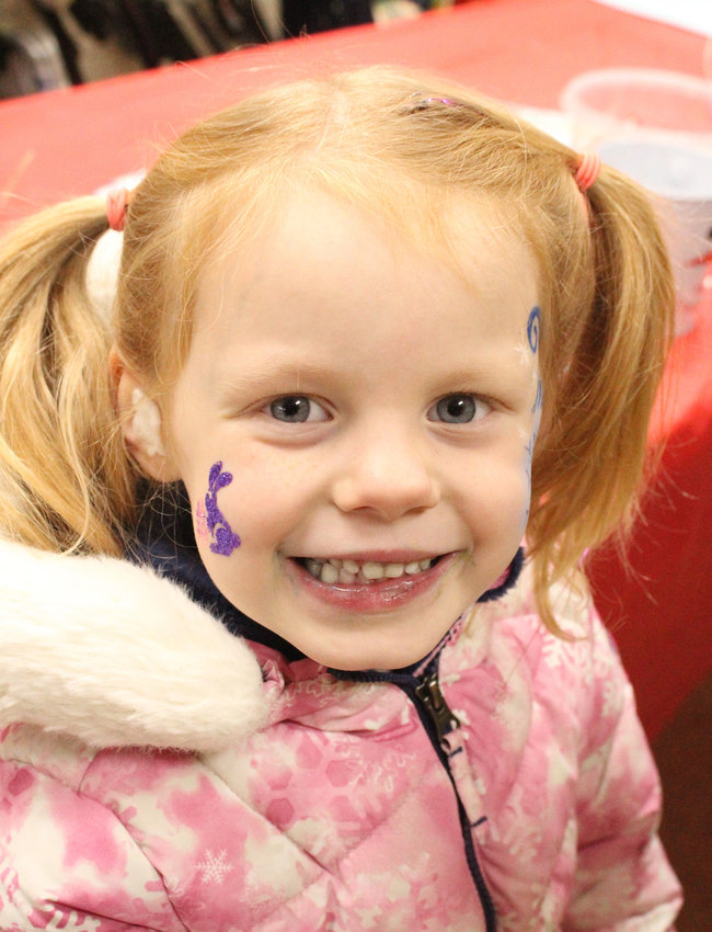 Elsie Eilers was happy to show off her glitter tattoos and face paint at this year’s Shiverfest in Logan.