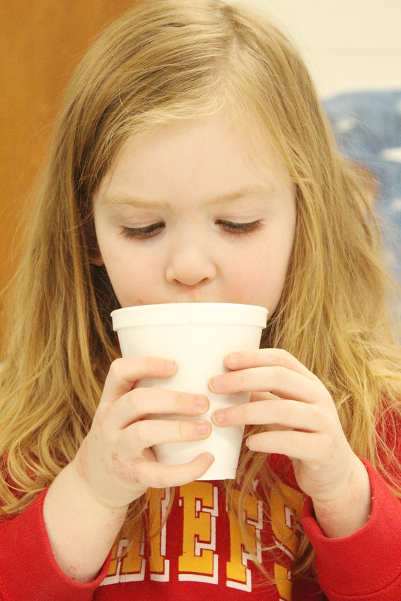 Mercy Bramley enjoyed hot chocolate and cookies during this years Shiverfest in Logan held on December 2nd .