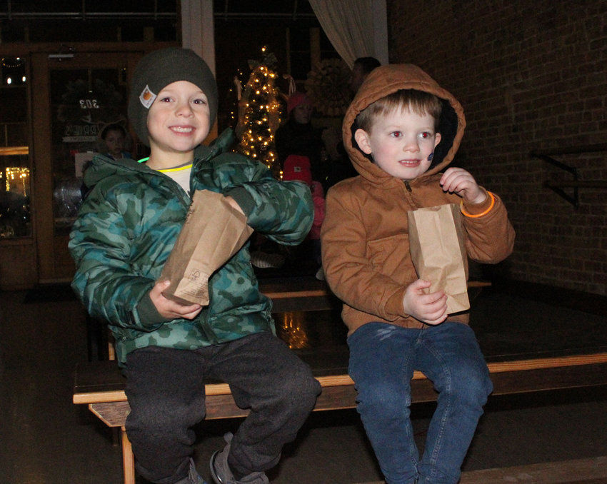 Dalton Jipp and Bennett Tapia snacked on some popcorn and watched a movie at Carrie’s Dance Academy during the winter festival in Logan over the weekend.