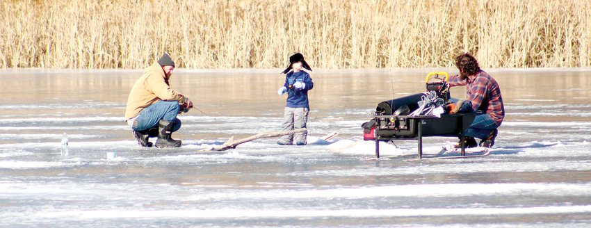 This little ice fisher was eager to help out and hopfuly catch a fish, warming hearts of on lookers over the chilly weekend in January.
