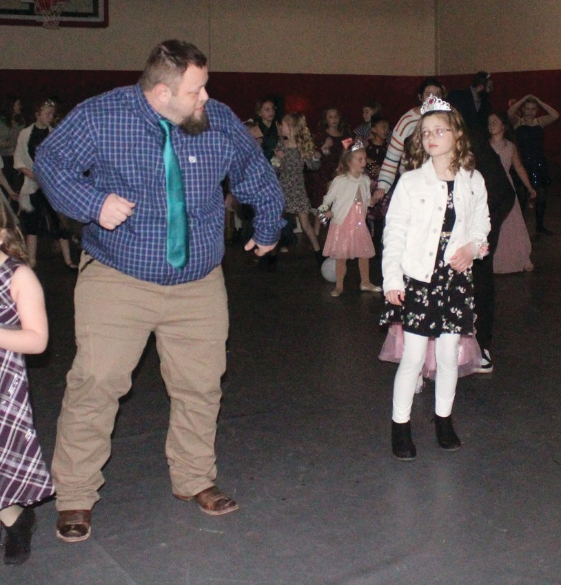 Jason Babcock shows his daughter Teagan his dance moves while attending the first ever Father Daughter dance in Missouri Valley last week.