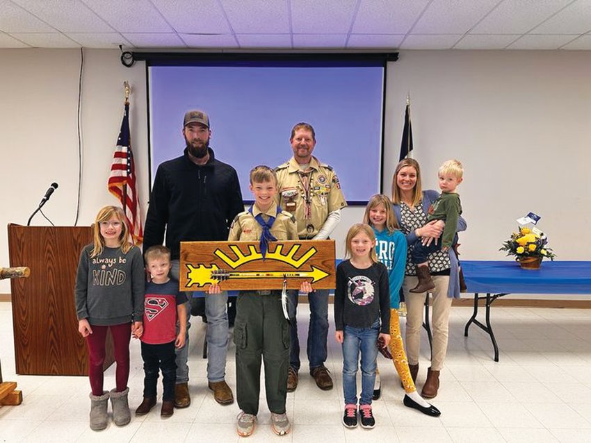 Noah Staben (middle) earned his Arrow of Light at the Cub Scouts Blue and Gold banquet on Sunday, Feb. 12. He's pictured with his father John Staben, mother Stefanie Staben, Brian Nelson (back), and siblings.