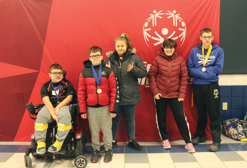 Student athletes of Missouri Valley Schools competed in the Special Olympics for basketball this winter season with all
earning medals for their age and skill groups. These students worked hard to overcome adversity while having fun in the
competition. In this photo the group posed in front of the Special Olympics banner. Pictured from left to right: Holden Kratky, Liam Murphy, Isis Leisy, Kaylee Holcomb, and Gage Killpack.