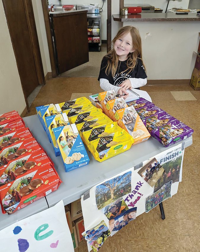Veada Wood welcomed customers of the Girl Scout cookie fundraiser with a friendly smile over the weekend.