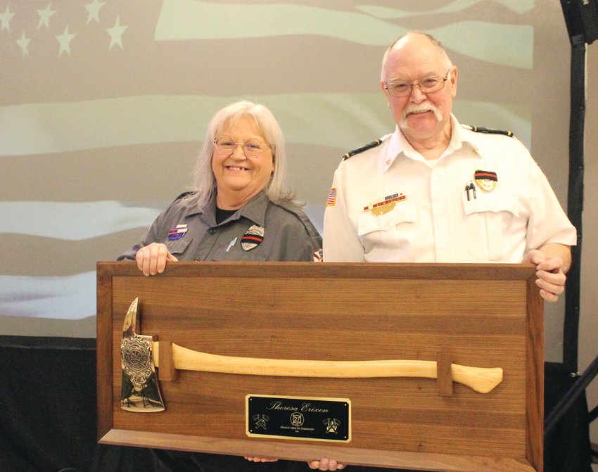 Teresa Erixon was honored for her many years of service. Her husband, Bob Erixon, presented her with an award in recognition of her hard work.