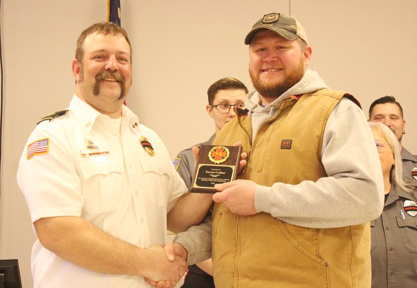 Caleb Wohlers presented Trevor Collier an award for 10 years of service.