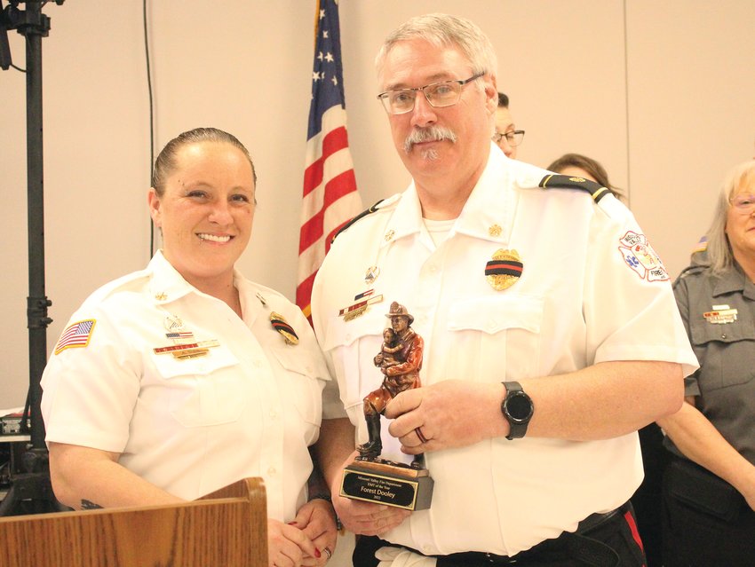 Angel Nies presented the "EMS of the Year" award to Forest Dooley. Dooley was also recognized for 35 years of service.