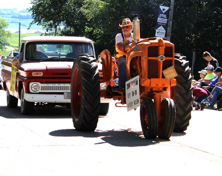 Charlie Wisecup drove an antique tractor in the Magnolia Old Settlers parade on Saturday, Aug. 21, 2021.