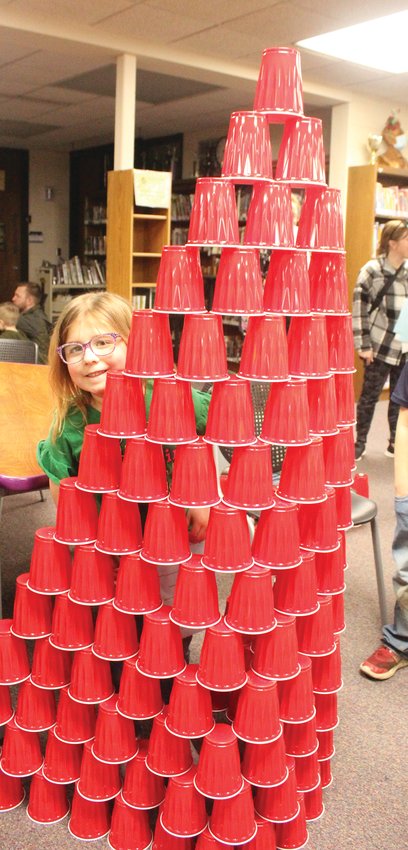 Piper Arbaugh made an impressive cup tower at the Logan family night.