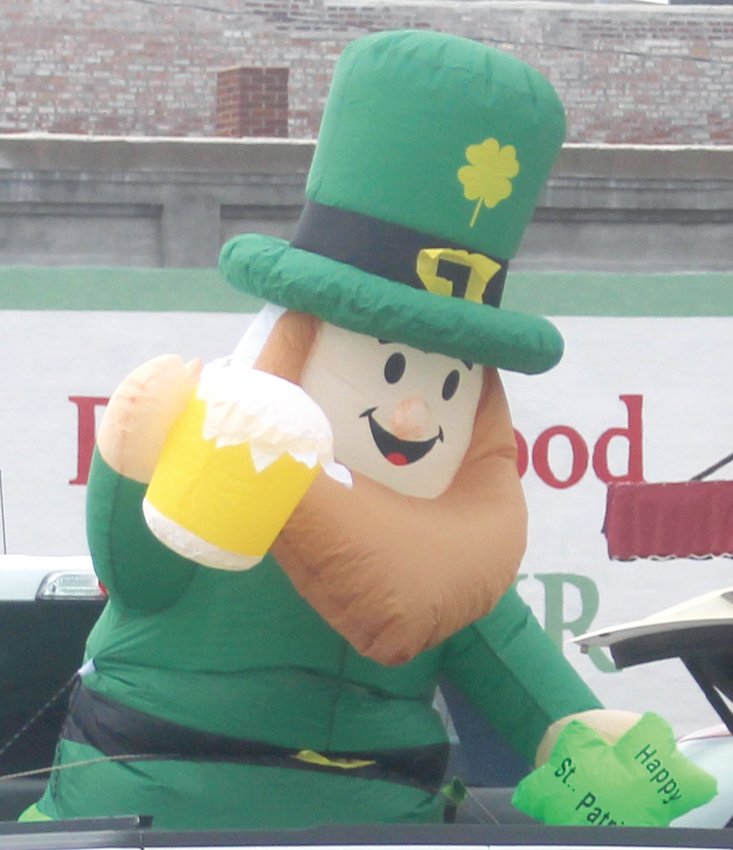 An inflatable leprechaun assists with the festivities during Dunlap's St. Patrick's Day parade.