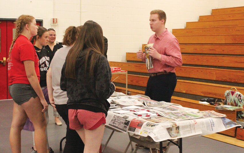 Associate editor Aaron Hickman speaks with Missouri Valley students at the Missouri Valley career fair held last Tuesday.