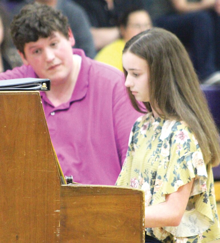 Piano Soloist:  Sophie Malone, with music instructor Benjamin Schauer watching on.