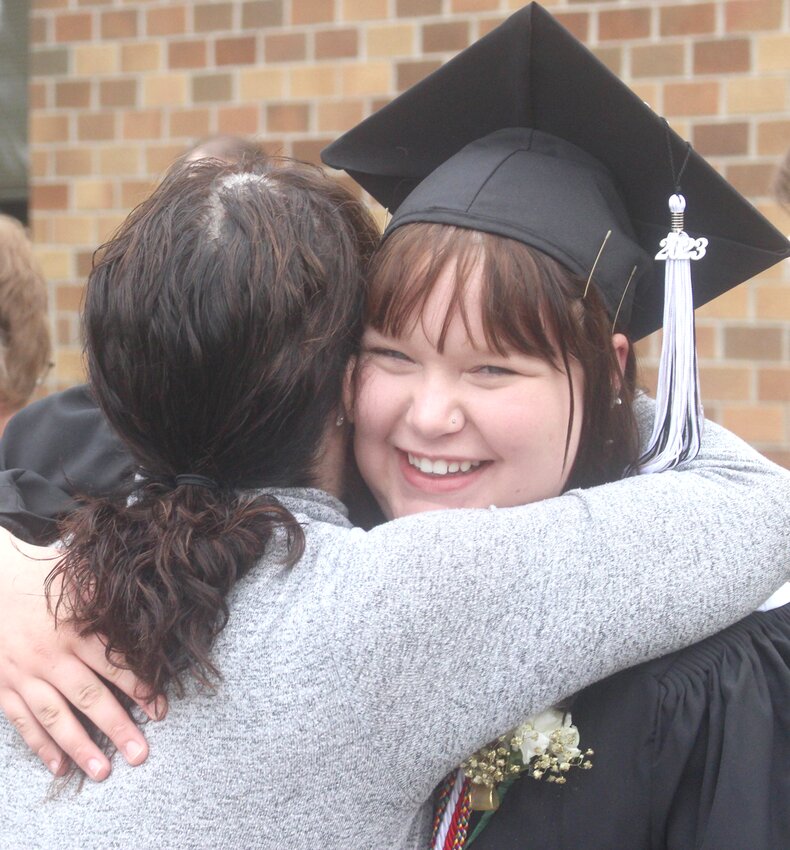 The Smile Says it All: West Harrison graduate Maggie Wolter is all smiles in the graduation line after the high school graduation ceremony on May 14 in Mondamin.