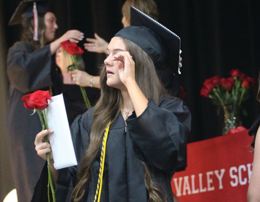 An emotional Ella Myler wipes a tear as she exits the stage.