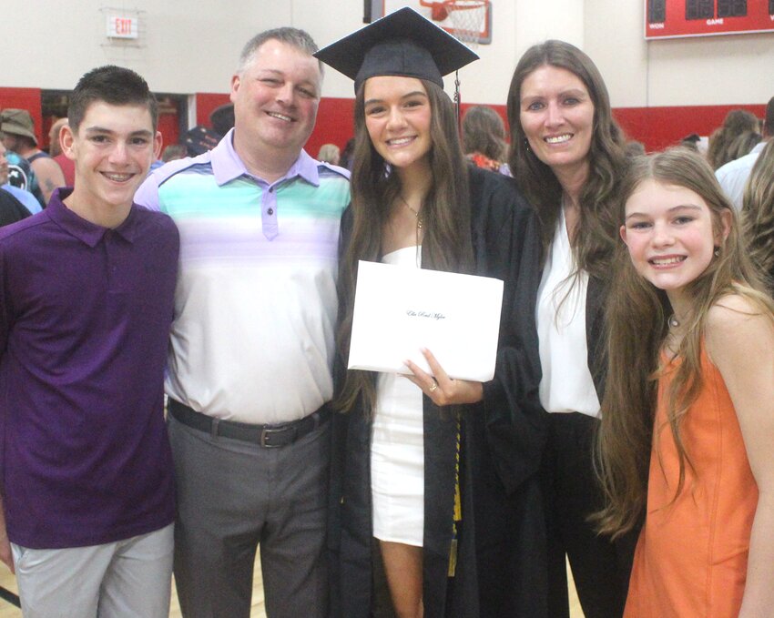 FAMILY MOMENT: A proud family moment as Ella Myler (center, with diploma) celebrates her life milestone with her family (from left:  Daxton, Jimmy, Ella, Bridget, and Dilynn Myler.