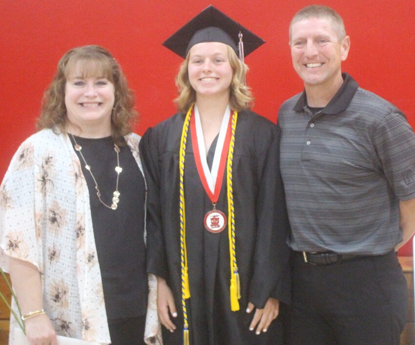Kaydence Cihacek smiles with her parents, Jennifer and Scott, after receiving her high school diploma on May 13.