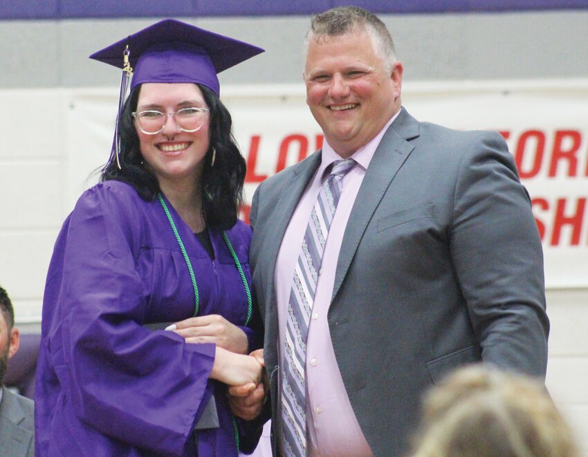 Bianca Palmer beams as she shakes hands with Superintendent Jeremy Christiansen.
