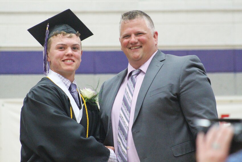 Ethan Hanigan has his picture perfect moment with Superintendent Jeremy Christiansen.