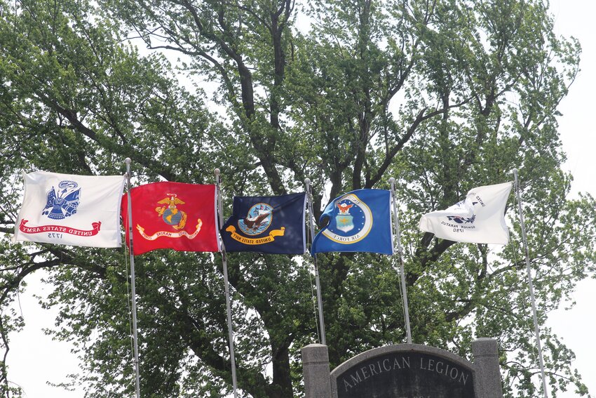 The flag for each branch of the Armed Forces swayed above Monday's presentation.