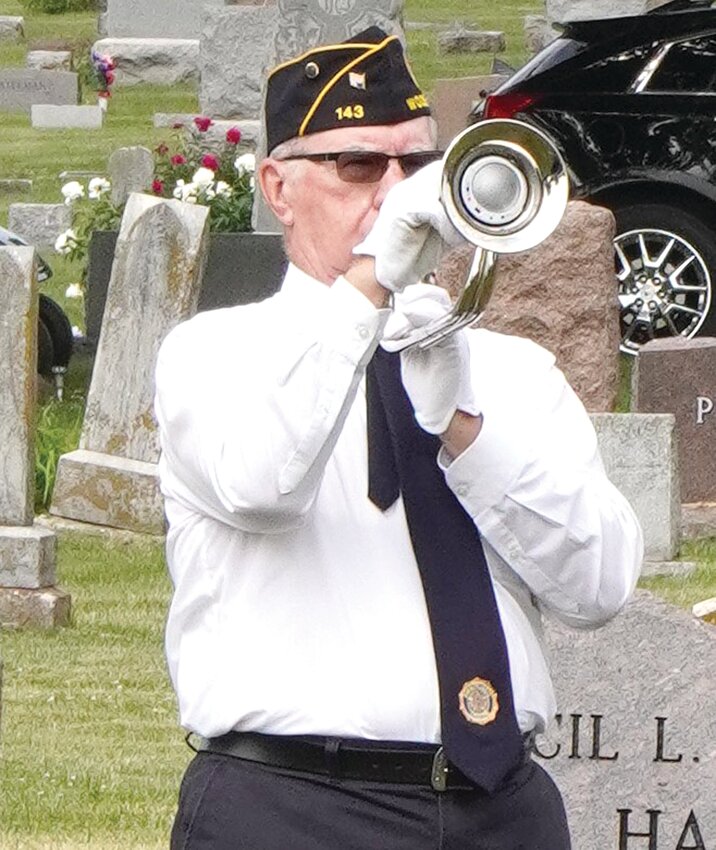 WOODBINE MEMORIAL DAY SERVICE:  Phil Fouts performs 'Taps' after the 21-gun salute in memory of those who were lost during battle.