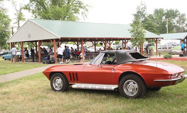 A rain shower could not keep away the fun, but did cause crowds to take cover and for the car show to conclude early.