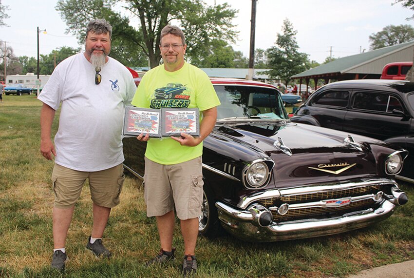Duane Livermore of Missouri Valley won the Mick’s Pick award at the fourth annual car show held in Missouri Valley over the weekend with his 1957 Chevy Nomad. Livermore reported that his Chevy has costume alligator interior along with being a small block Chevy with 350/430 HP. Livermore also shared that this has been his dream car since he was 16 years old. Presenting this award to Duane Livermore is Stewart McDunn.