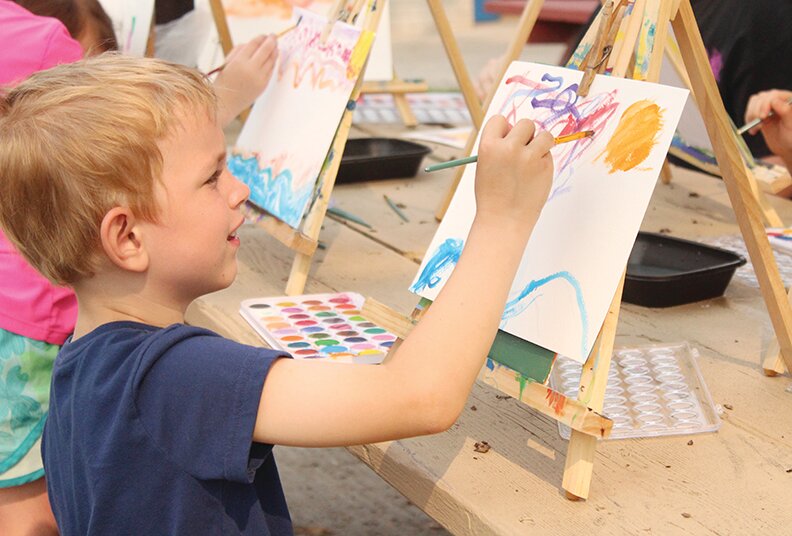Children enjoyed learning about watercolor paints and painting sunsets at the Magnolia Park.