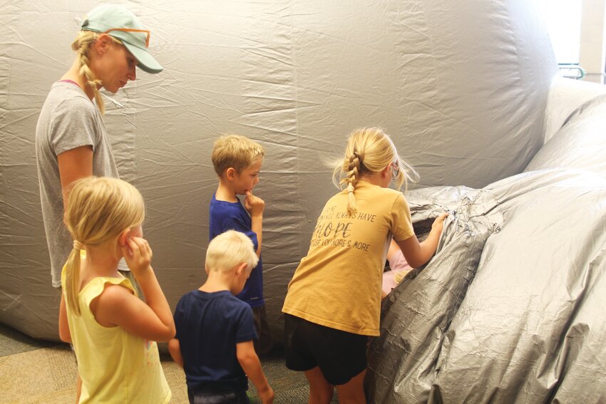 Parents and kids lined up to enter the planetarium at the Missouri Valley Public Library last Wednesday. Presented by Gifford Farm Education Center out of Bellevue, Neb., two different groups spread apart by 30 minutes participated.
