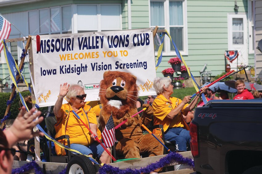 The mascots were out on a warm day, including the Lions Club lion.