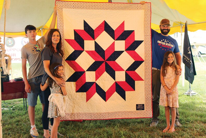 Veteran Service Officer with Harrison County Veterans Affairs, Brittany Freet, was awarded a quilt for her outstanding service to Harrison County Veterans. Here she can be seen with her family and the quilt she was awarded.