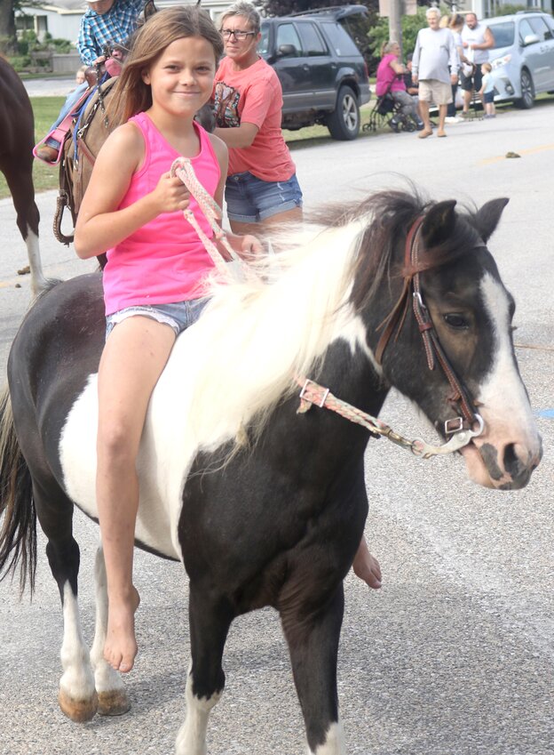 Bratlynn Frisk of Woodbine rides her horse through the Little Sioux Homecoming Parade on Aug. 26 at Little Sioux.