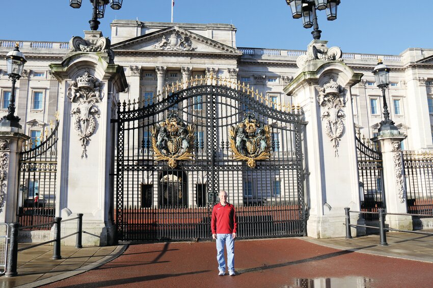 Carter Oliver stands in front of Buckingham Palace in London.
