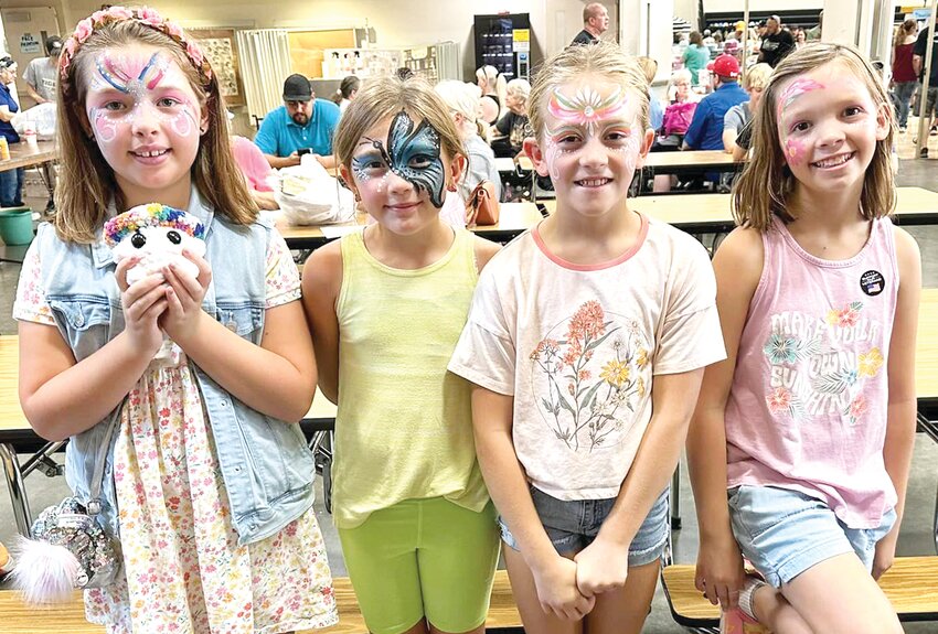 These girls enjoyed getting their faces painted at the Woodbine Applefest.  They include, from left, June Johnson, Adilynn Utman, Reghan Utman, Paige Higgins.