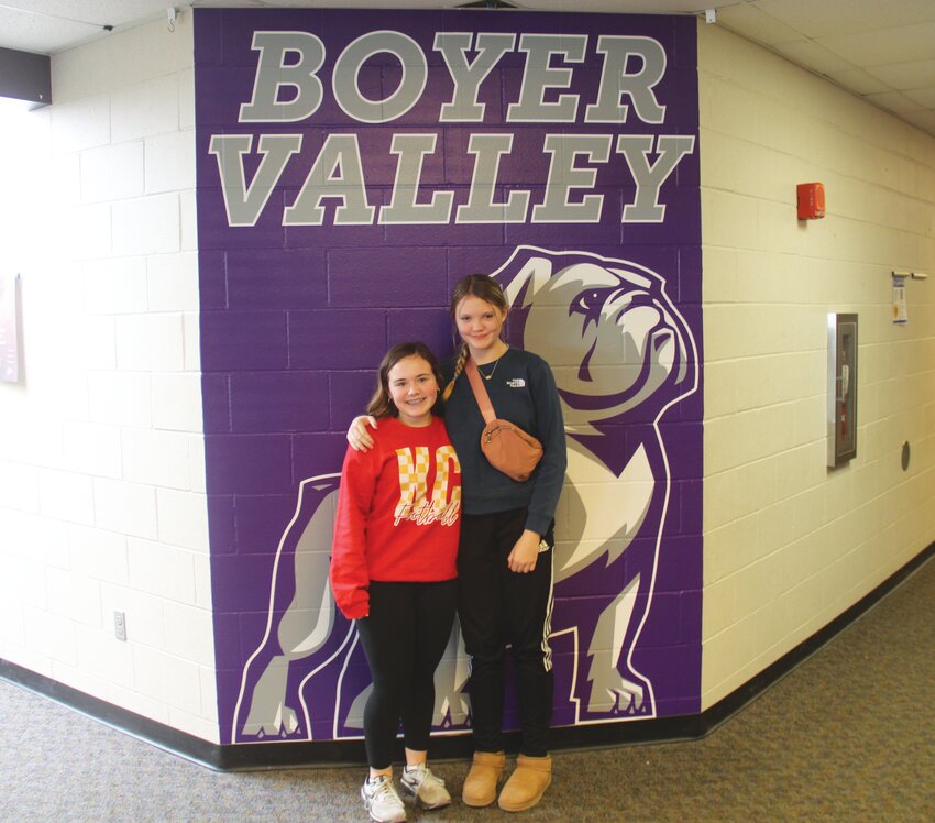 Harper Christiansen (left) and Addison Dumbaugh (right) helped organize the Boyer Valley Middle School student council's recent fundraiser for Perry and mental health services.