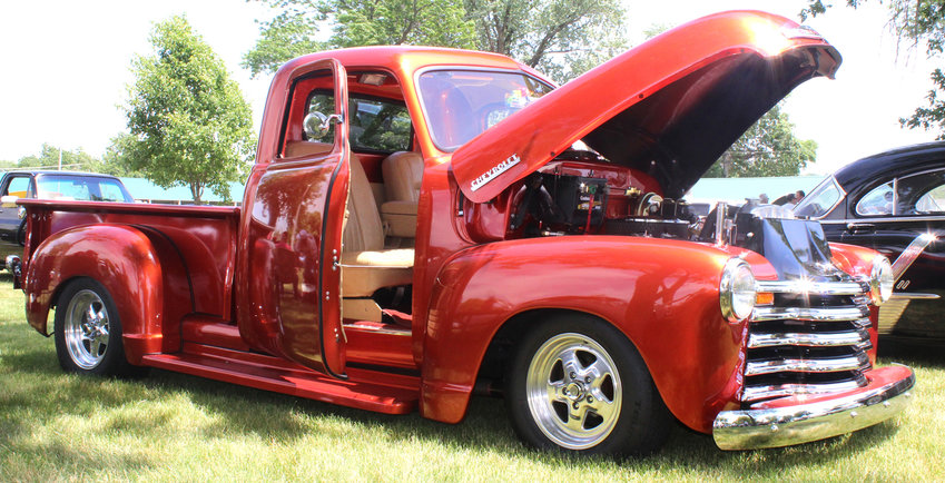 &quot;Mick's Pick,&quot; was chosen by the wife and children of the late Mick McDunn, at the inaugural Eagles Club Car Show, in memory of McDunn. This truck, pictured above, is a 1952 Chevy truck with custom suicide doors, a pristine interior and engine, as well as a polished paint job and custom hardwood bed.