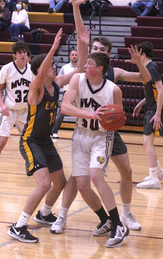 Dawson Gress looks for an open teammate against Lawton-Bronson. Gress finished the game with 20 points.