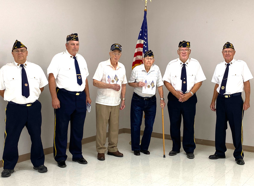 Bud Busing and Buck Winther, shown here in the center, were honored during a small ceremony on Saturday, July 31 at the Rand Community Center..The two veterans were honored for 75 years of service through the American Legion in addition to their previous service to the country, according to Leroy Sulley, Commander of Julius F. Muller American Legion Post 337 of Missouri Valley..