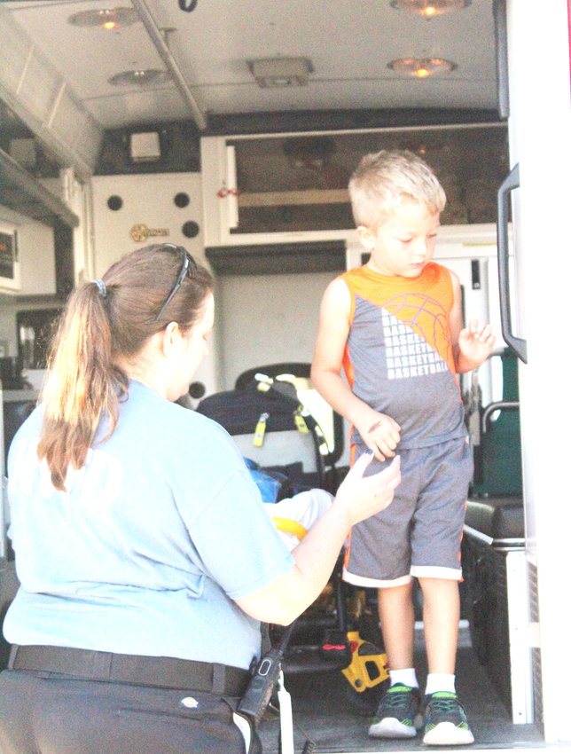 Bentley Soule looking at a ambulance during the Missouri Valley Fire Prevention program.
